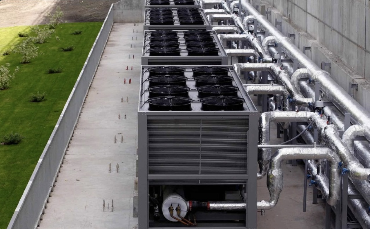Rooftop chiller units and insulated cooling pipework serving a data centre